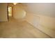 View of the attic featuring neutral-colored carpet, and attached room at 1309 Wakefield Farm Rd, Zebulon, NC 27597