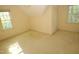 Carpeted bedroom featuring natural light from two windows at 1309 Wakefield Farm Rd, Zebulon, NC 27597