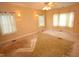 Spacious bedroom featuring windows, carpet, and a ceiling fan at 1309 Wakefield Farm Rd, Zebulon, NC 27597