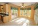 Sunlit breakfast area with a view of the wooden deck, seamlessly connecting indoor and outdoor spaces at 1309 Wakefield Farm Rd, Zebulon, NC 27597