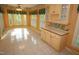 Bright breakfast area with tile flooring, large windows, and custom cabinetry at 1309 Wakefield Farm Rd, Zebulon, NC 27597
