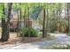 Lovely home with mature trees, an attached garage, and convenient driveway at 1309 Wakefield Farm Rd, Zebulon, NC 27597