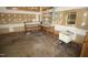Unfinished garage with utility sink, shelving, and painted walls at 1309 Wakefield Farm Rd, Zebulon, NC 27597