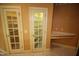 Hallway featuring two closet doors and a built-in desk at 1309 Wakefield Farm Rd, Zebulon, NC 27597