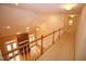 Hallway showcasing a fireplace, hardwood floors, ceiling fan, and natural light at 1309 Wakefield Farm Rd, Zebulon, NC 27597