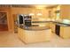 Well-equipped kitchen featuring stainless steel appliances, granite countertops, and a functional island at 1309 Wakefield Farm Rd, Zebulon, NC 27597