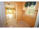 Bright laundry room featuring tiled floors, natural light, and washer/dryer hookups at 1309 Wakefield Farm Rd, Zebulon, NC 27597