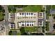 Birds eye view of modern townhome community with manicured landscaping and paved driveways at 1317 Garner Rd # 101, Raleigh, NC 27610