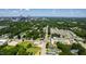 Aerial view of a lush city landscape with a modern community in the foreground at 1317 Garner Rd # 101, Raleigh, NC 27610