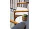 Balcony seating area featuring a wooden chair and small round table with succulent centerpiece at 1317 Garner Rd # 101, Raleigh, NC 27610
