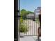 Inviting balcony with a potted fern and wrought iron railing overlooking the neighborhood street at 1317 Garner Rd # 101, Raleigh, NC 27610