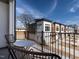 Relaxing balcony with a view of modern townhomes under a bright sky, offering serene outdoor living space at 1317 Garner Rd # 101, Raleigh, NC 27610