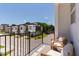 Balcony overlooking modern townhomes and lush landscaping, offering a serene outdoor living experience at 1317 Garner Rd # 101, Raleigh, NC 27610