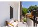 Cozy balcony featuring outdoor seating with a view of modern architecture and greenery at 1317 Garner Rd # 101, Raleigh, NC 27610