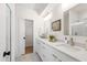 Spacious bathroom with dual sinks, white cabinetry, and a glass-enclosed shower at 1317 Garner Rd # 101, Raleigh, NC 27610