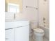 Well-lit bathroom featuring modern sink and tiled shower with contemporary fixtures at 1317 Garner Rd # 101, Raleigh, NC 27610