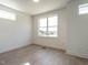 Bright bedroom with large windows and hardwood floors, offering a welcoming space at 1317 Garner Rd # 101, Raleigh, NC 27610
