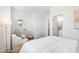 Bright bedroom featuring a comfortable chair, modern decor, and ensuite bathroom at 1317 Garner Rd # 101, Raleigh, NC 27610