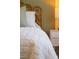 Close-up of a bedroom featuring a wicker headboard and a comfortable bed at 1317 Garner Rd # 101, Raleigh, NC 27610
