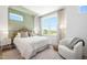 Inviting bedroom with large window, decorative headboard, and stylish furnishings at 1317 Garner Rd # 101, Raleigh, NC 27610