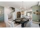 Open dining space with a stylish table, modern light, cabinet, and seamless transition to a bright kitchen at 1317 Garner Rd # 101, Raleigh, NC 27610