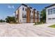 Modern townhomes with brick paved parking, garages, and private balconies at 1317 Garner Rd # 101, Raleigh, NC 27610