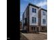 Contemporary townhome featuring a modern facade and neat front yard landscaping at 1317 Garner Rd # 101, Raleigh, NC 27610