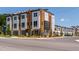 A street view showcases modern townhomes with stylish exteriors, set on well-maintained lawns at 1317 Garner Rd # 101, Raleigh, NC 27610