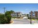 Street-level view showcasing modern townhome exteriors, highlighting their design and street presence at 1317 Garner Rd # 101, Raleigh, NC 27610