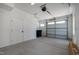 Spacious two car garage with bright white walls and ceilings with an automatic garage door opener at 1317 Garner Rd # 101, Raleigh, NC 27610