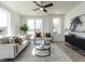 Bright living room boasts large windows, modern furnishings, and stylish decor for a comfortable and inviting space at 1317 Garner Rd # 101, Raleigh, NC 27610