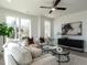 Bright living room boasts large windows, modern furnishings, and stylish decor for a comfortable and inviting space at 1317 Garner Rd # 101, Raleigh, NC 27610