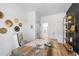 Bright office area featuring a large work space and modern shelving with decor at 1317 Garner Rd # 101, Raleigh, NC 27610