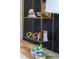 Close up of modern office decor featuring gold shelving and stylish accessories at 1317 Garner Rd # 101, Raleigh, NC 27610