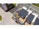 Aerial view of a rooftop deck, complete with modern patio furniture, creating an inviting outdoor living space at 1317 Garner Rd # 101, Raleigh, NC 27610