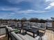 Relaxing rooftop deck offers an outdoor oasis with comfortable seating and scenic neighborhood views at 1317 Garner Rd # 101, Raleigh, NC 27610