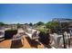Inviting rooftop patio with comfortable seating, planters, and neighborhood views at 1317 Garner Rd # 101, Raleigh, NC 27610