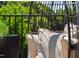 Close up of a hanging chair on a peaceful rooftop patio with green leafy plants at 1317 Garner Rd # 101, Raleigh, NC 27610