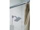Modern shower with a square shower head and a white tiled wall at 1317 Garner Rd # 101, Raleigh, NC 27610
