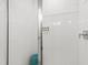 Elegant white tiled shower with built-in niche and stylish accent stool at 1317 Garner Rd # 101, Raleigh, NC 27610