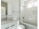 Bright bathroom featuring tiled shower and tub, a large mirror, and contemporary fixtures at 1408 Sawyer Rd # 101, Raleigh, NC 27610
