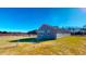 This home features a spacious backyard and modern gray vinyl siding at 163 Grace Pond Ave, Benson, NC 27504