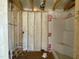 Bathroom framing shows plumbing and shower insert installation, setting the stage for a modern and functional bathroom design at 163 Grace Pond Ave, Benson, NC 27504