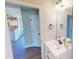 Bathroom with a modern vanity, white cabinets, and stylish fixtures at 163 Grace Pond Ave, Benson, NC 27504