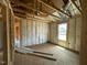 Bedroom during construction highlighting the layout, window placement, and readiness for customization and finishing touches at 163 Grace Pond Ave, Benson, NC 27504