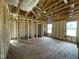Bedroom framing during construction, featuring window placement and overall layout for spacious living and natural light at 163 Grace Pond Ave, Benson, NC 27504