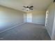 Spacious bedroom features neutral walls, plush gray carpet and a ceiling fan at 163 Grace Pond Ave, Benson, NC 27504