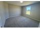 Bedroom features neutral paint, new carpet and a window for natural light at 163 Grace Pond Ave, Benson, NC 27504