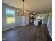 Dining area showcasing an open layout, hard surface floors, and natural light with views of the outside at 163 Grace Pond Ave, Benson, NC 27504