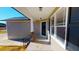 Covered front porch with stone pillars and ample windows, offering a cozy entrance at 163 Grace Pond Ave, Benson, NC 27504